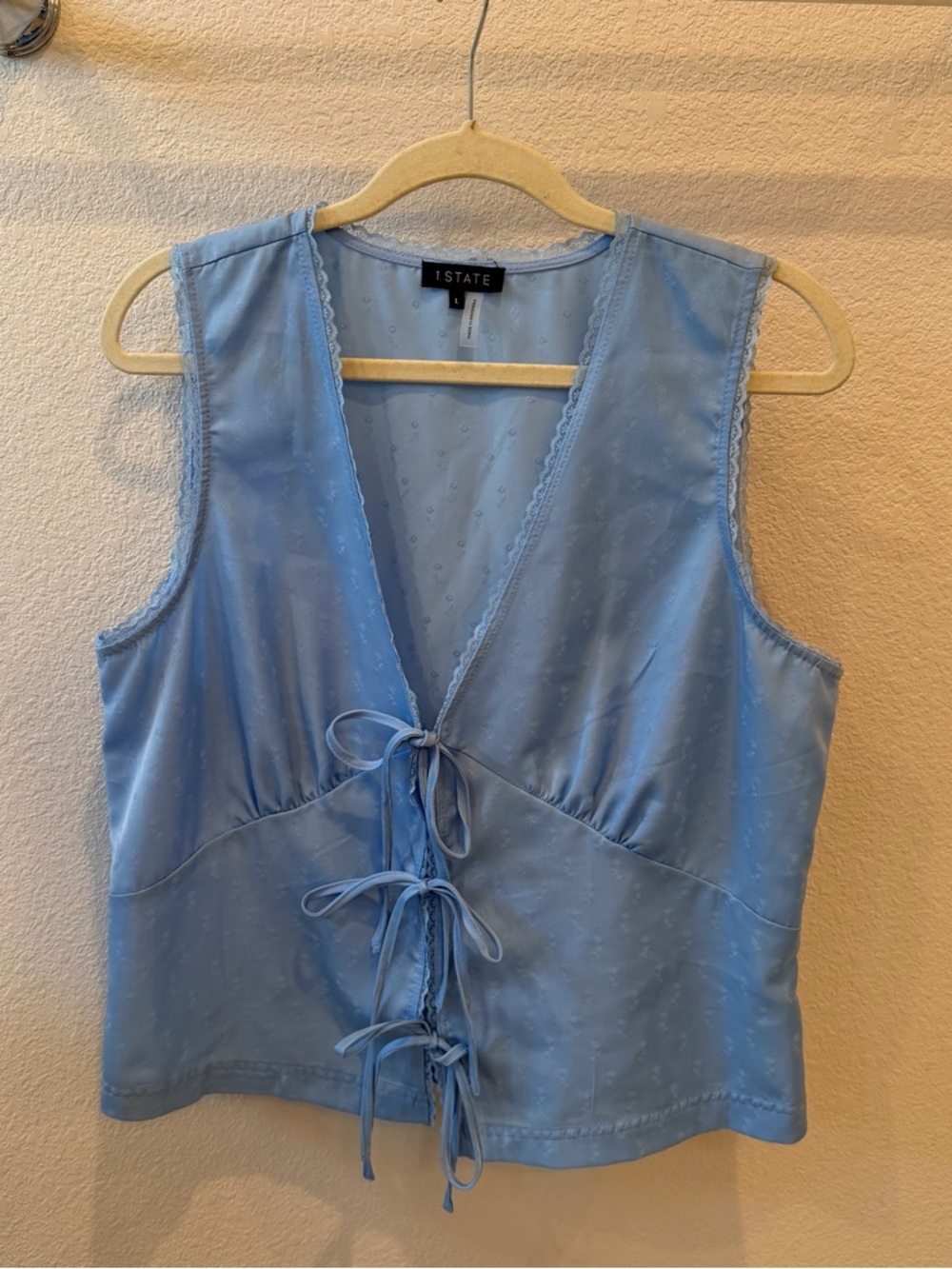 1. STATE Blue Floral Sleeveless Tie Front Top